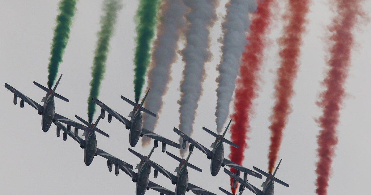 The Frecce Tricolori fly over Monza trailing green, white and red smoke before the Italian Grand Prix.